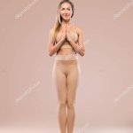 Indoor Yoga Classes. Sports recreation. Beautiful young woman in asana pose. Individual sports. Nude sportswear. Stock Photo MikeOrlov 329836226