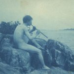 File:Man posed on rocks nude playing pipe Pan photograph by Frances Benjamin Johnston