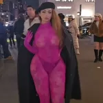 Curvy model strips to see-through catsuit on street making people stop and stare