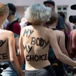 Berlin welcomes topless female swimmers in victory for activists