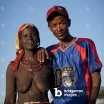 Image of Mucawana Man Dressed in a Western Way with a Topless