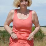 Mature blonde Hillary gets fully naked to show her hairy pussy out...