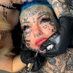 Australian bombshell Amber Luke gets a new chin tattoo