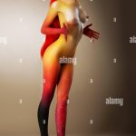 Bodyart. Sexy Nude Woman with Bronzed Skin Stock Photo