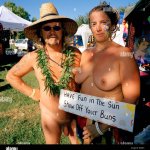 As Nudestock is a naked music festival individuals use flamboyant accessories to decorate their bodies Stock Photo