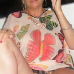 Sexy mature woman Dimonty gets naked after smoking a cigarette on balcony