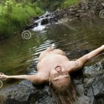 Nude woman in stream. stock image. Image of beautiful