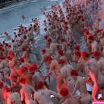 Push through the painful bit: record 3000 people join nude Dark Mofo swim in Derwent