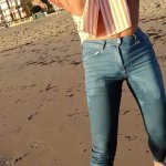 Wet shoot on a public beach with Crazy Model. Risky outdoor masturbation. Foot fetish. Pee in jeans.