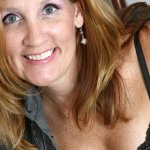 Mature amateur Lilly does a striptease to pose in the nude at home